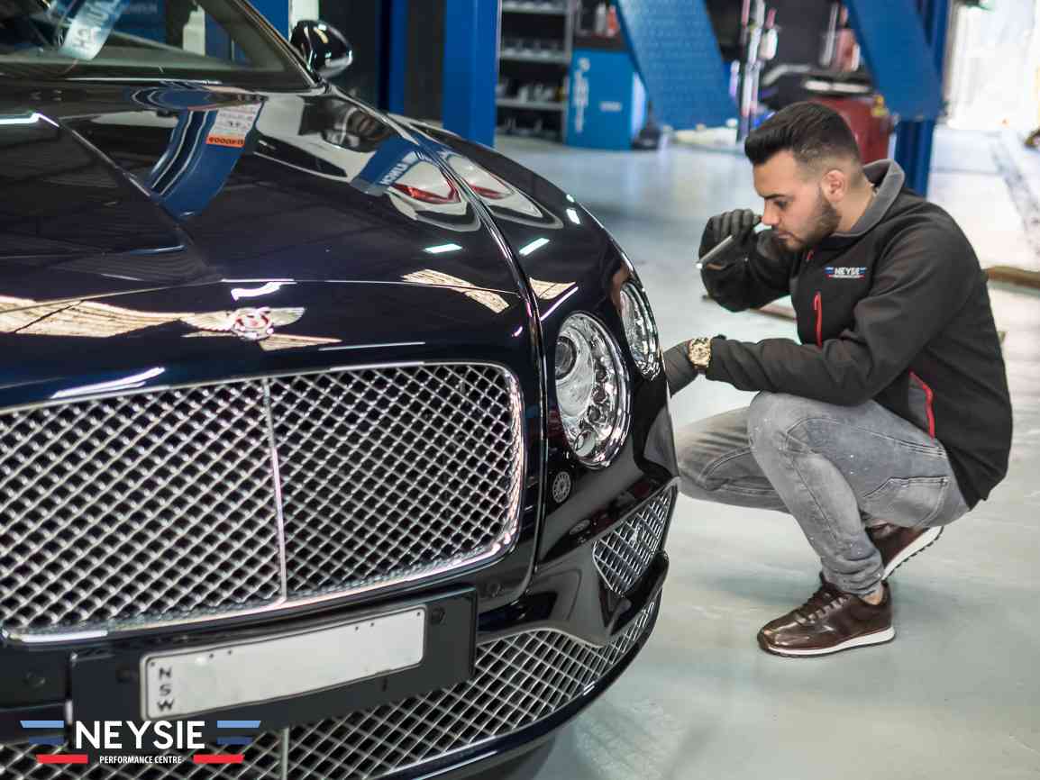 Bentley in mechanic workshop.