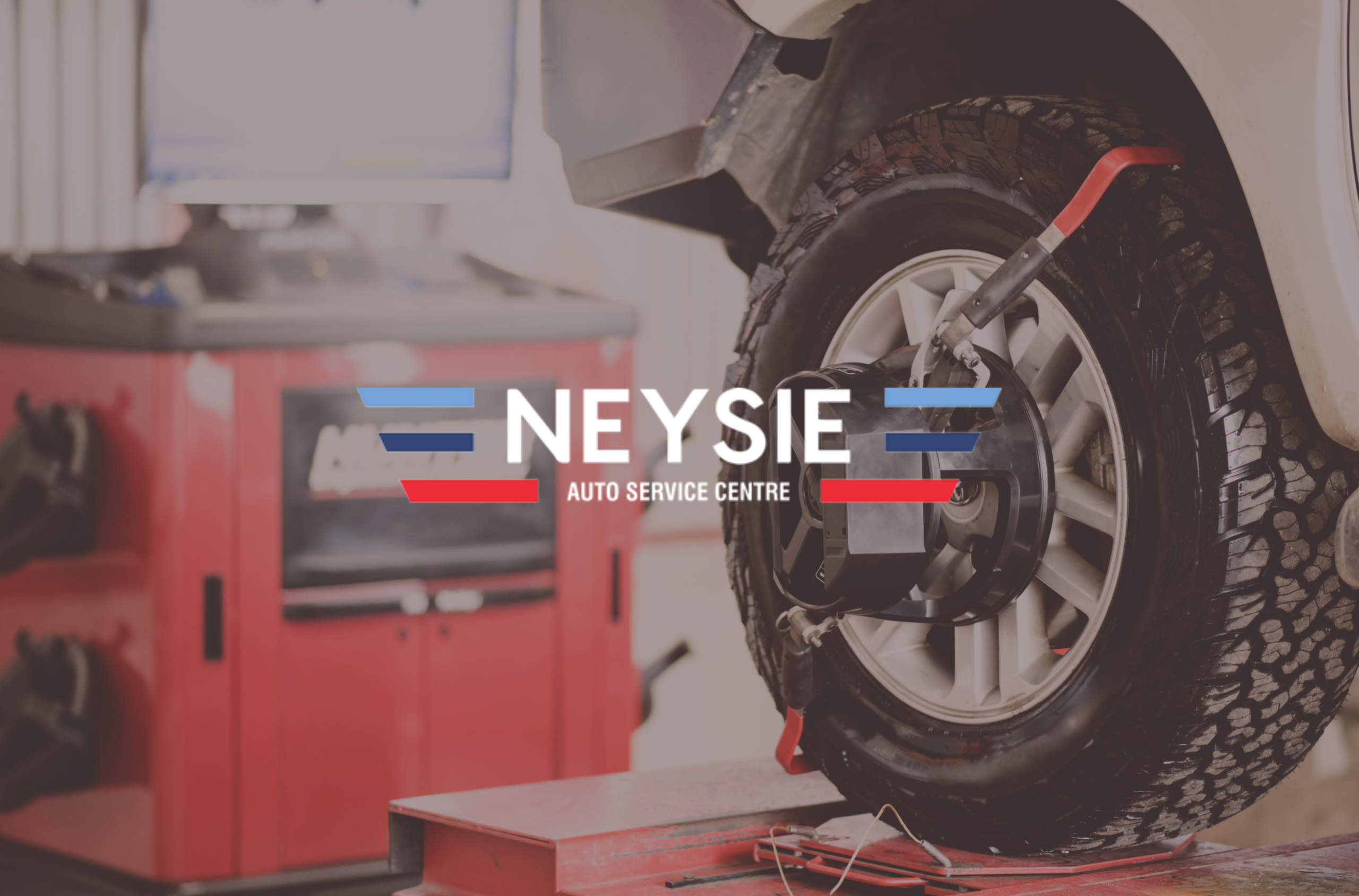 Professional wheel alignment Rydalmere service at Neysie Auto Service Centre with technician inspecting suspension and steering components.